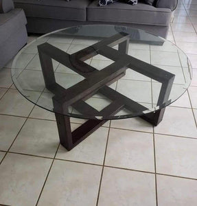 Round glass coffee table with geometric metal base