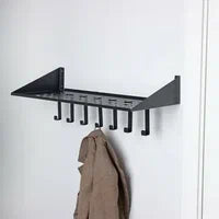 Black wall mounted coat rack with triangular shelf and 7 hooks