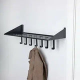 Black wall mounted coat rack with triangular shelf and 7 hooks