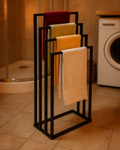 Towel rack with folded towels in a bathroom setting