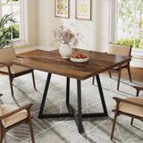 Rustic wood dining table with black metal legs and chairs
