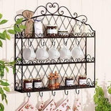 Vintage black wall-mounted spice rack with hooks and jars