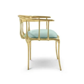 Elegant mint green velvet chair with gold metal frame