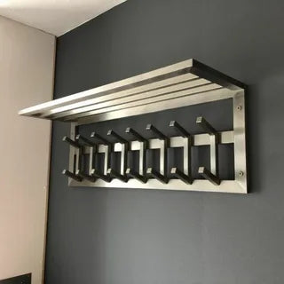 Modern metal wall-mounted coat rack with hooks and top shelf
