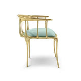 Elegant mint green velvet chair with gold metal frame