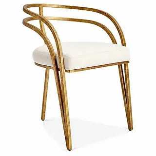 Elegant curved gold dining chair with white cushion